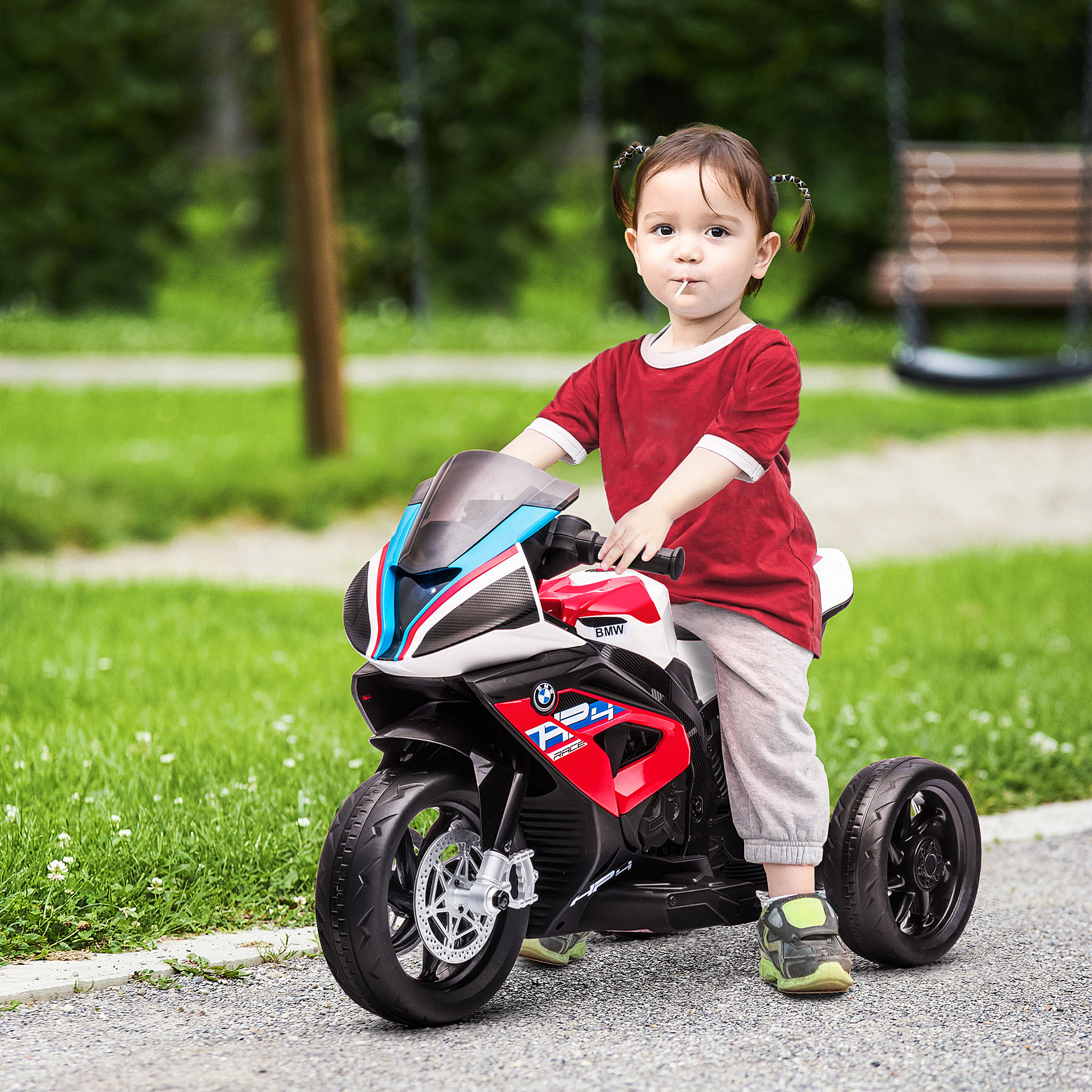 Happy toddler boy riding bike. Kids enjoying a bicycle ride. Spo